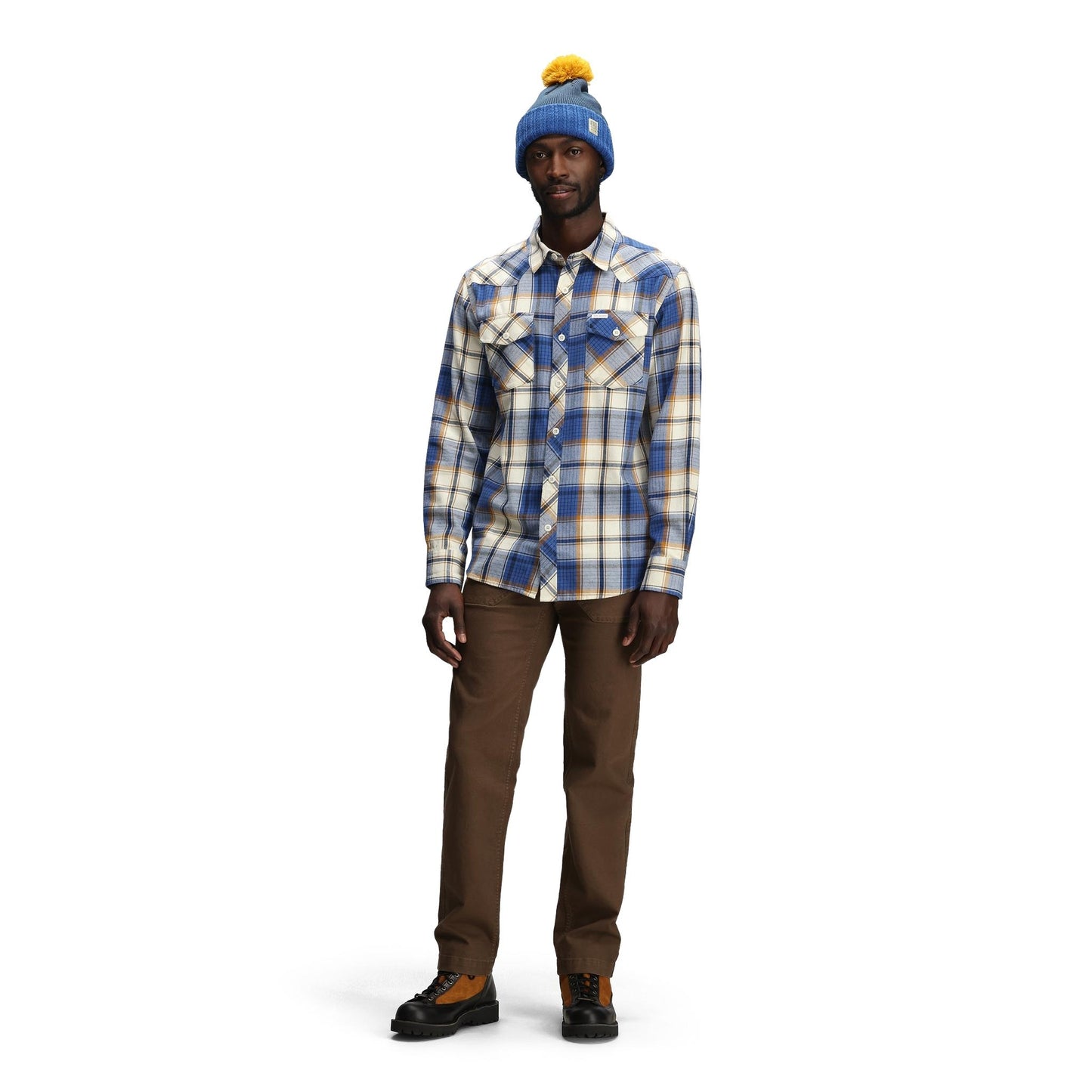 General front model shot of Topo Designs Pompom Beanie in "Cobalt / Midnight"