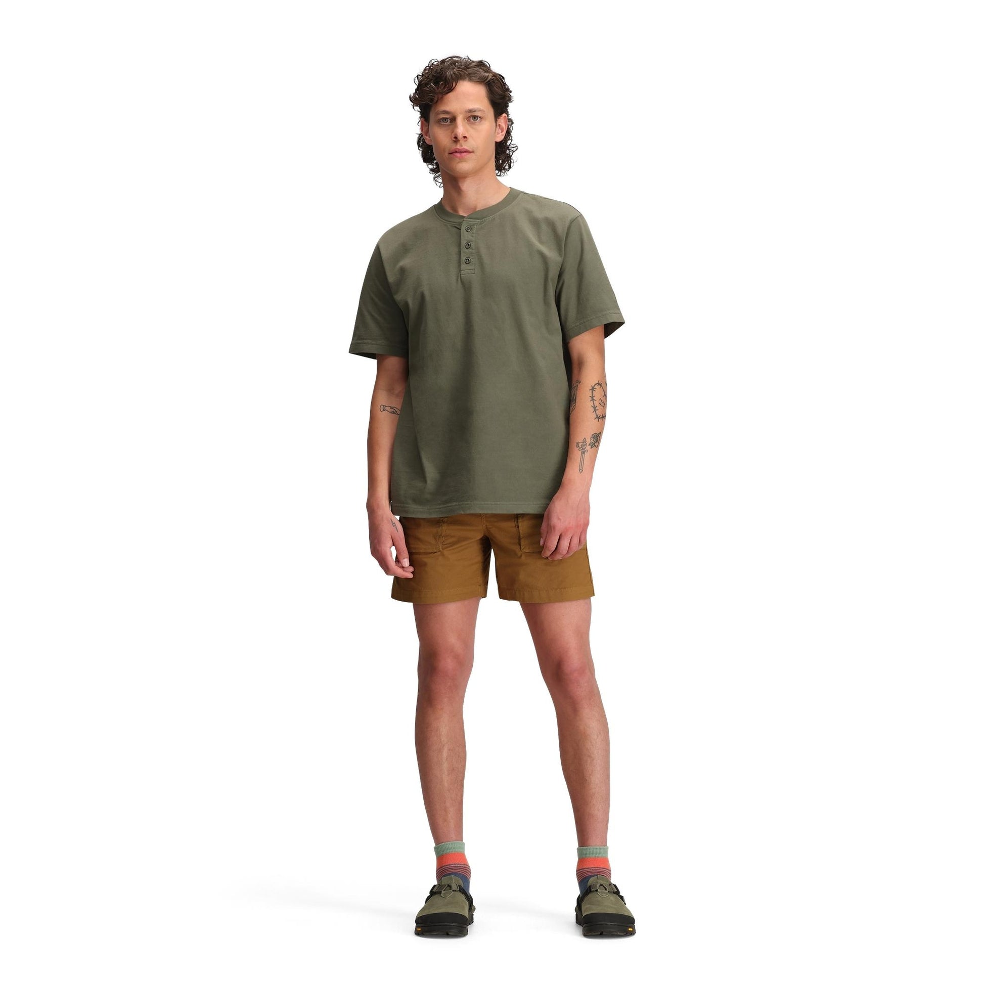 General front model shot of Topo Designs Dirt Henley Short Sleeve - Men's in "Beetle"