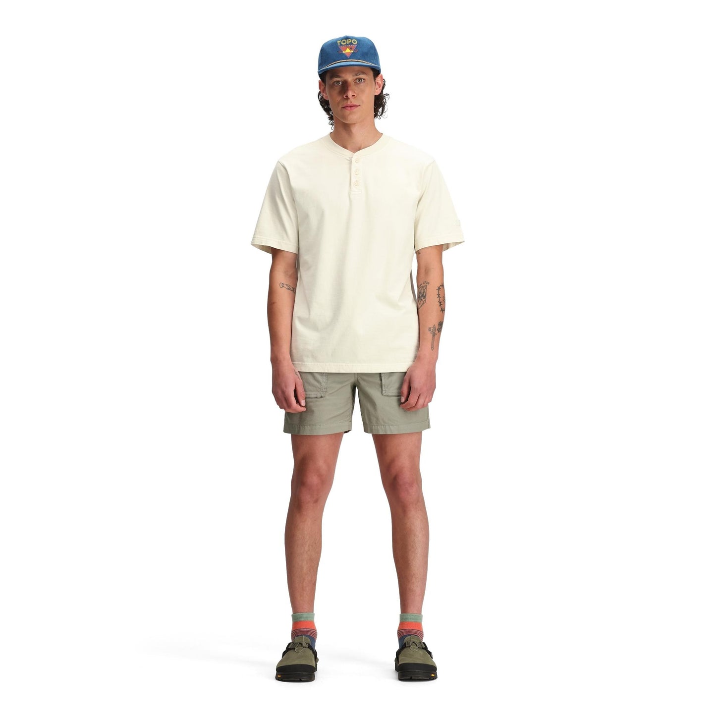 General front model shot of Topo Designs Dirt Henley Short Sleeve - Men's in "Bone White"