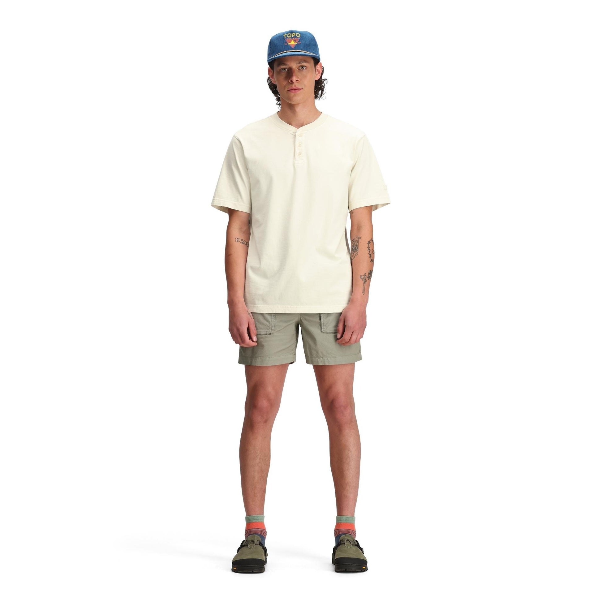 General front model shot of Topo Designs Dirt Henley Short Sleeve - Men's in "Bone White"